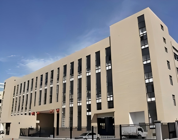 Modern manufacturing facility exterior, clean industrial building, YIHUI MACHINERY signage